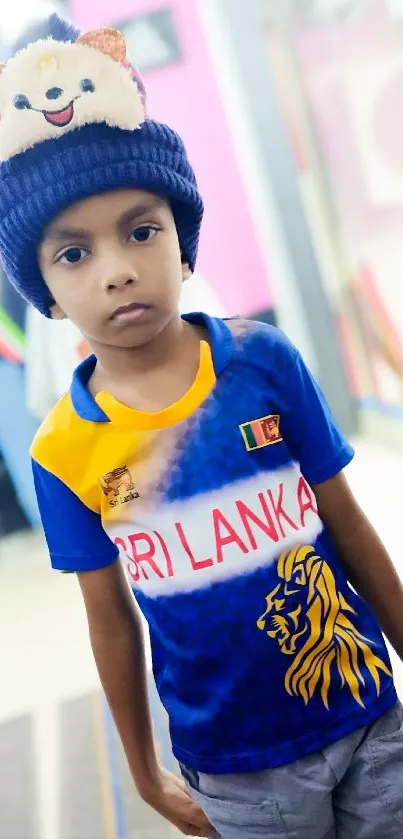 Child in Sri Lanka cricket jersey with a blue and yellow theme.