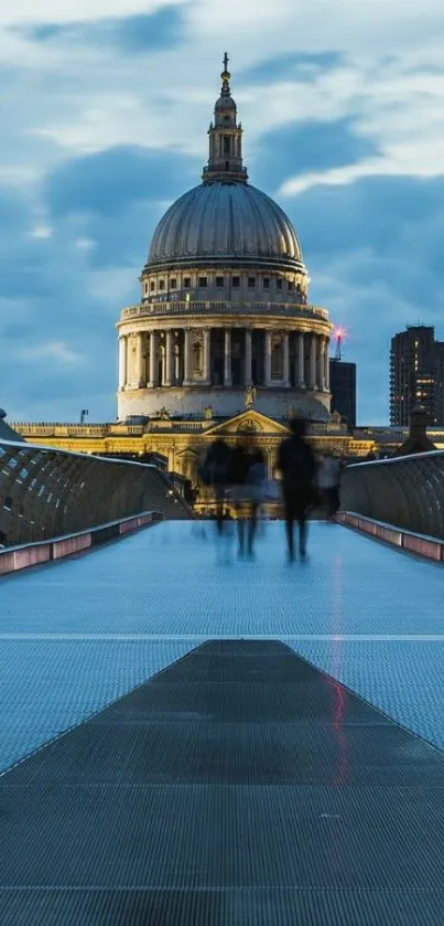 St. Paul's Cathedral at dusk with blue sky and bridge.