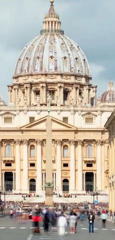 St. Peter's Basilica in Vatican City with crowds in the foreground.