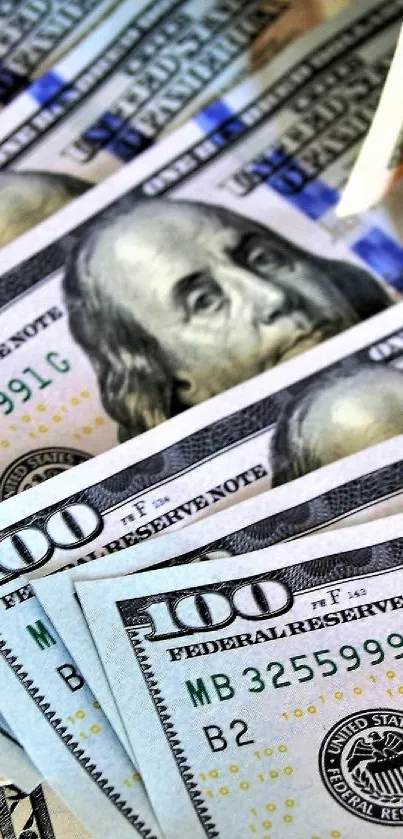 Close-up of stacked 100 dollar bills.