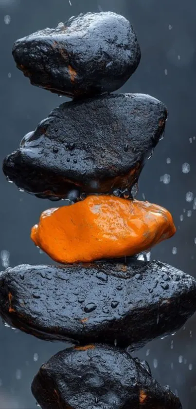 Stacked stones with orange rock centerpiece and rain droplets.