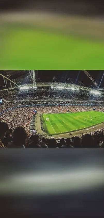 Panoramic view of stadium during a nighttime football match.