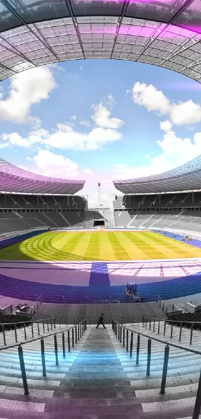 Stadium interior with a vibrant field and open sky above.