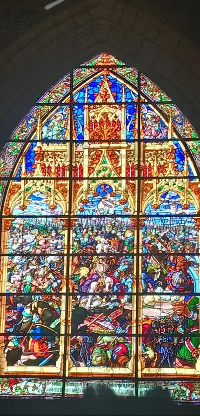 Intricate stained glass window with vibrant medieval art.