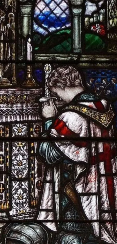 Stained glass depicting a medieval knight in prayer.