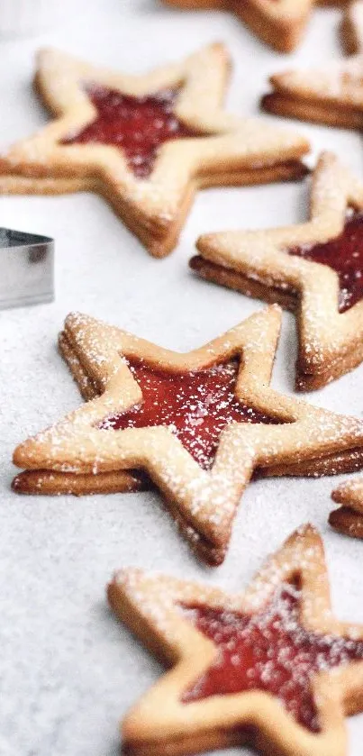 Star-shaped cookies with jam center on a light background.