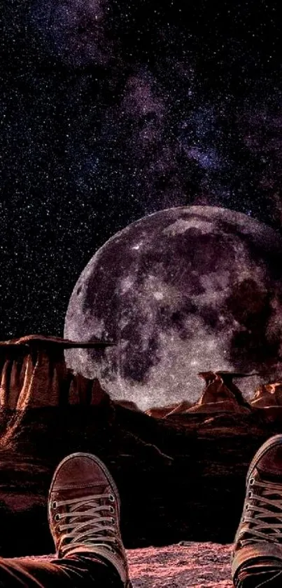 Person's view of a moonlit rocky landscape under a starry sky.