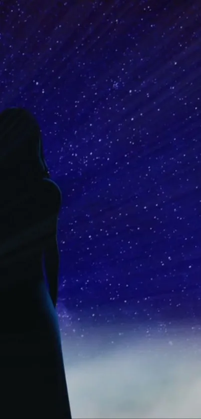 Silhouette of a person stares at a starry night sky, filled with countless twinkling stars.