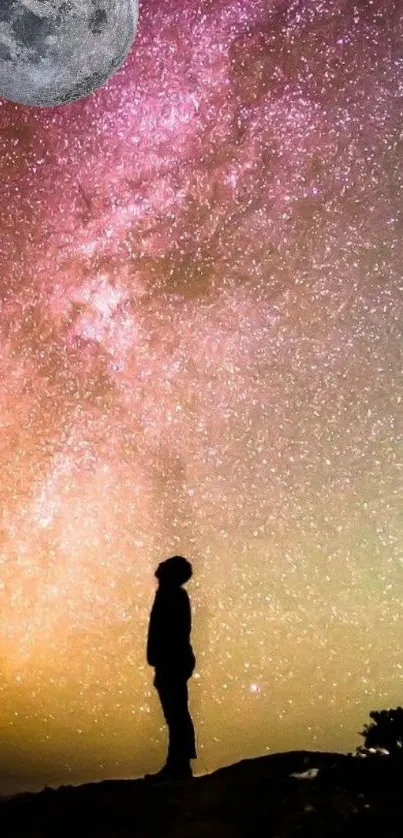 Silhouette stargazer under vibrant night sky and moon.