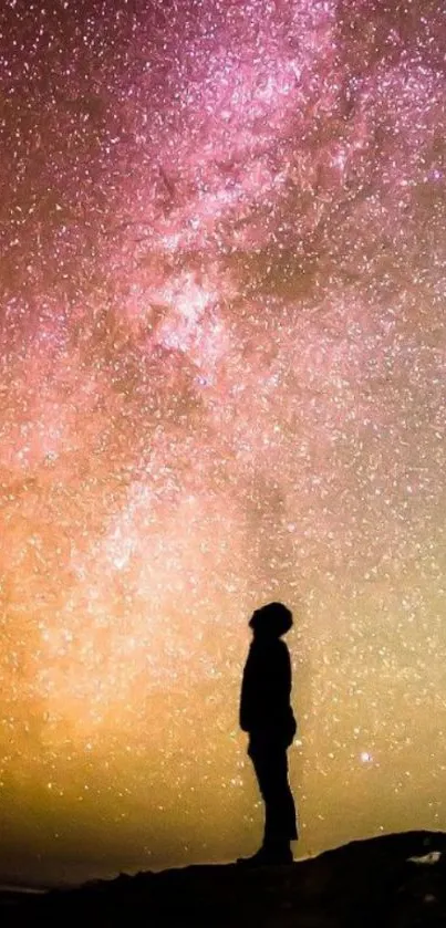 Silhouette under a vibrant Milky Way night sky wallpaper.