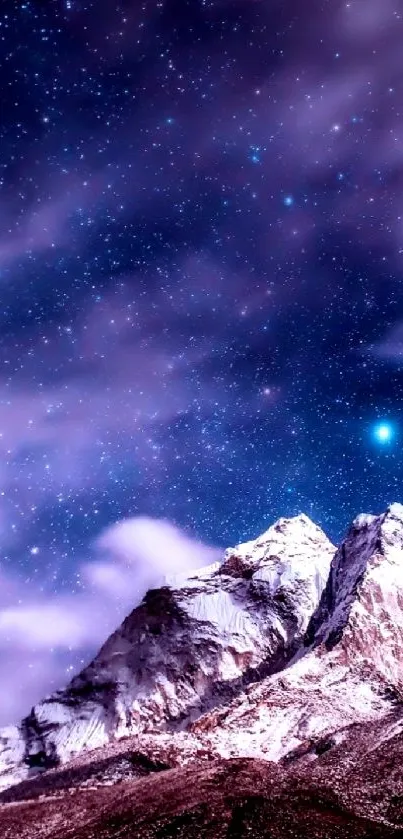 Mountain peak under a starlit night sky with clouds and stars.