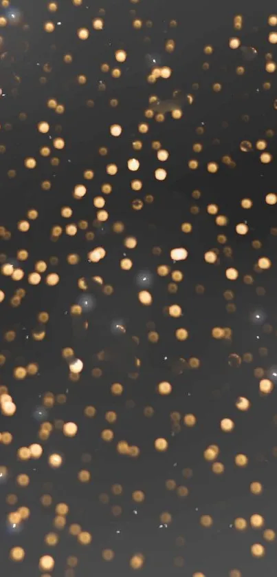 Mobile wallpaper with golden bokeh lights on a dark background.
