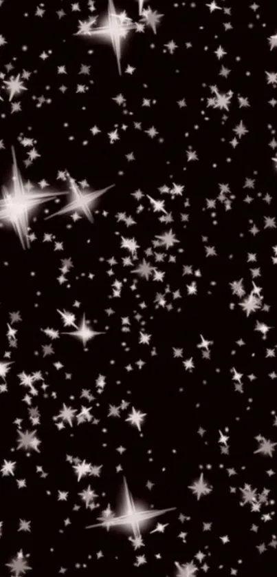 Starlit night wallpaper with glowing stars on a black background.