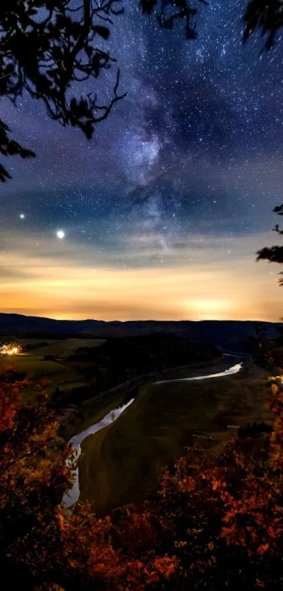 Starlit night sky with river and autumn foliage.