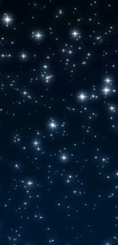 Starlit night sky wallpaper with scattered stars against a deep blue background.