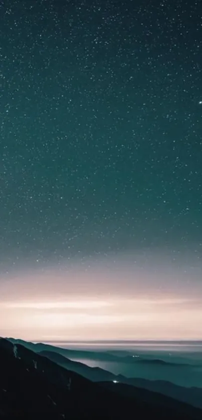 Starry sky over a calm mountain landscape at night.