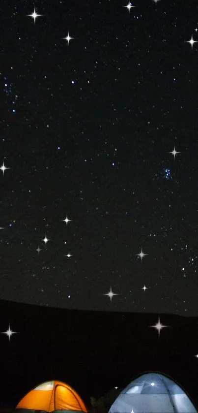 Starry night sky with tents illuminated under starlight.