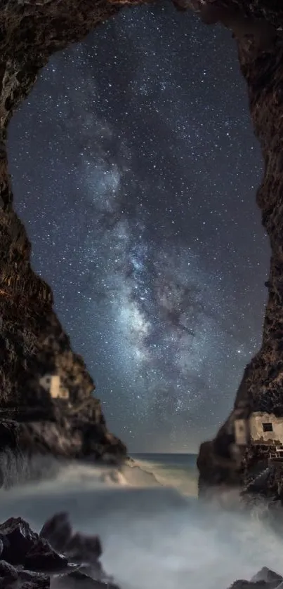 Starry night sky through a rocky cave with milky way visible.