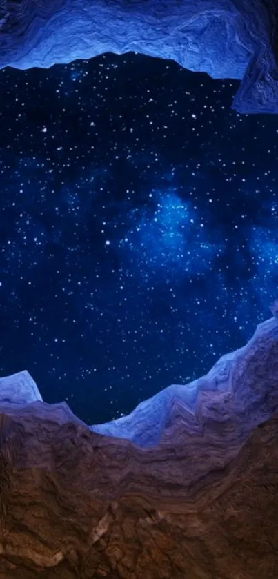 Cave opening view of a starry night sky filled with blue and white stars.