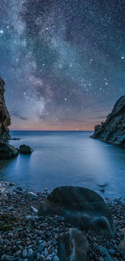 A beautiful starry night sky over a serene ocean with rocky shores.