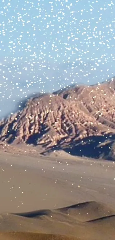 A starry sky over a desert mountain landscape.