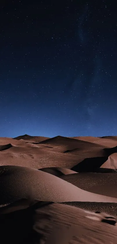 Starry night over desert dunes, creating a tranquil mobile wallpaper.