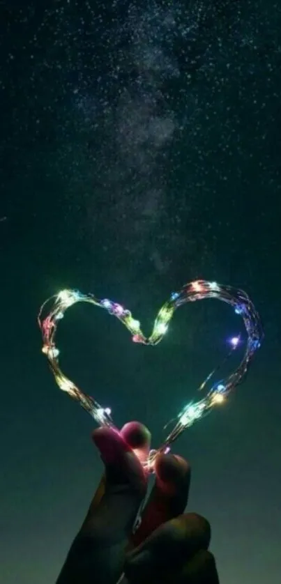 Heart-shaped light under a starry night sky wallpaper.