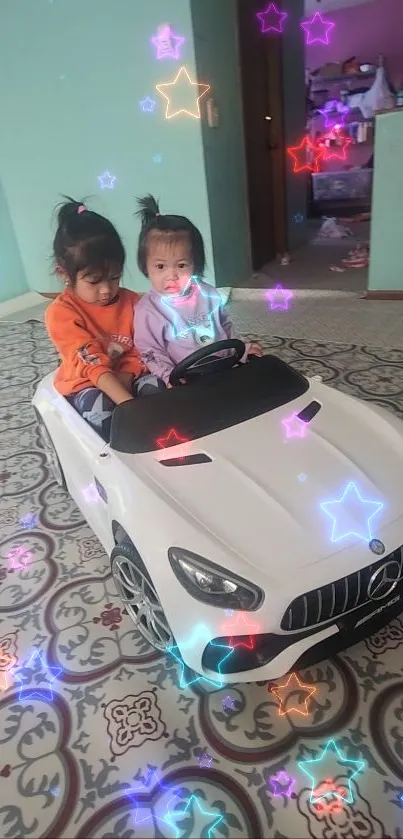 Children in toy car with colorful stars background.