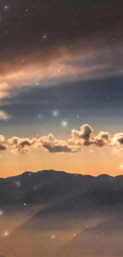 Starry night sky above misty mountains, creating a serene and calming scene.