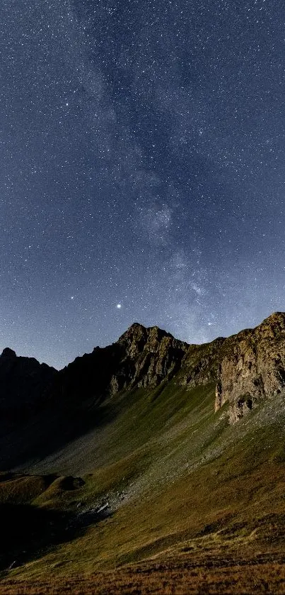 Starry night sky above mountains in serene landscape wallpaper.