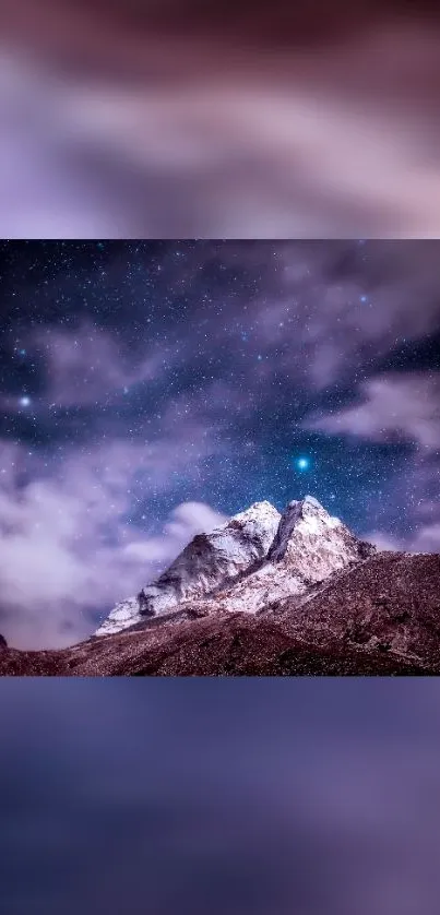 Starry night sky over snowy mountains wallpaper.