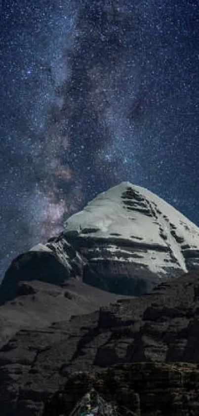 Starry night sky over a snow-capped mountain peak in a serene nightscape.