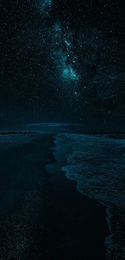 Dark starry night sky over a tranquil ocean beach scene.