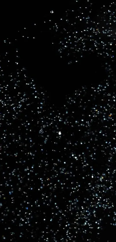 Black wallpaper with shimmering starry specks on a dark background.