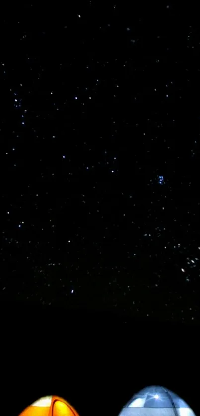 Starry night sky above a campsite with tents shining in the foreground.