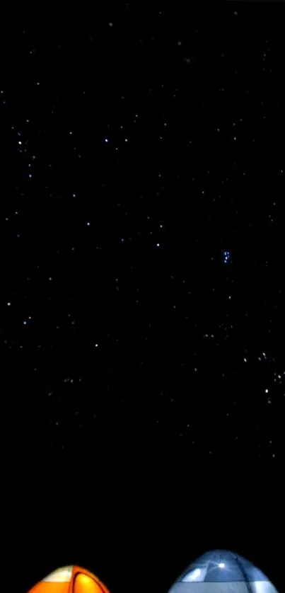 Starry sky with lit tents showcasing nighttime camping adventure.