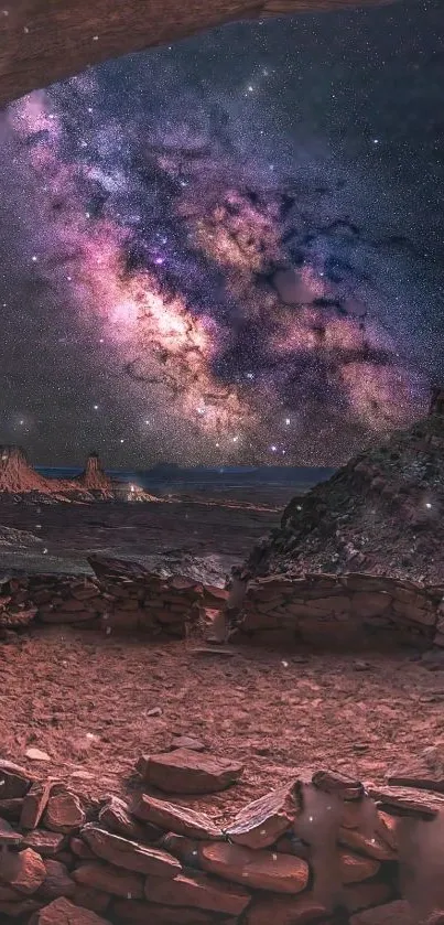 Starry night sky over the canyon with visible Milky Way and desert landscape.