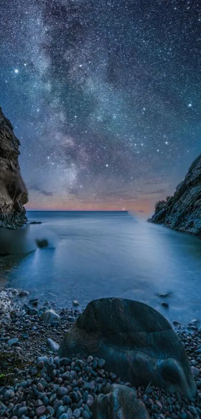 A serene starry night over a calm coastal scene with a rocky foreground.