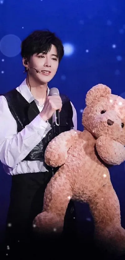 Performer with teddy bear under a starry blue sky.