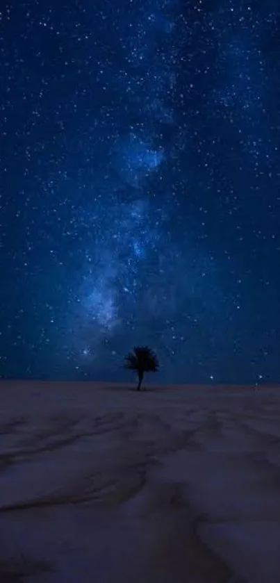 Desert night sky with stars and lone tree, deep blue tones.