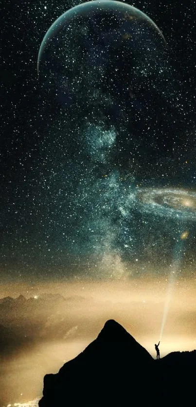 A breathtaking galaxy view with stars over a mountain silhouette.