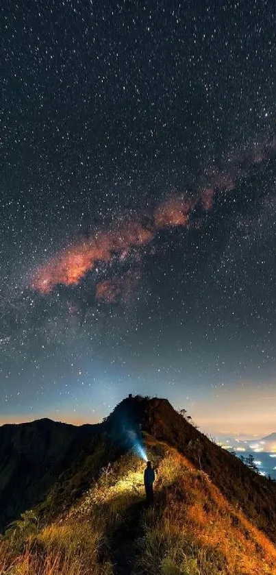 Starry night sky over mountain path illuminated by the Milky Way.