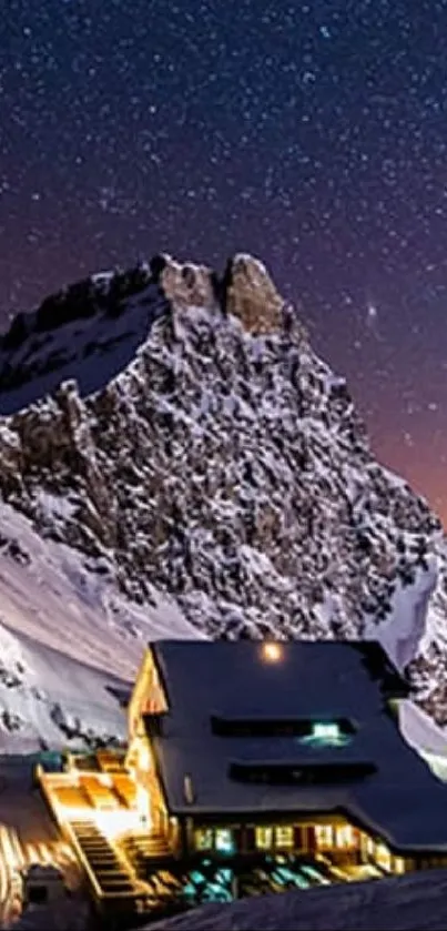 Snowy mountain lodge under a starry night sky.