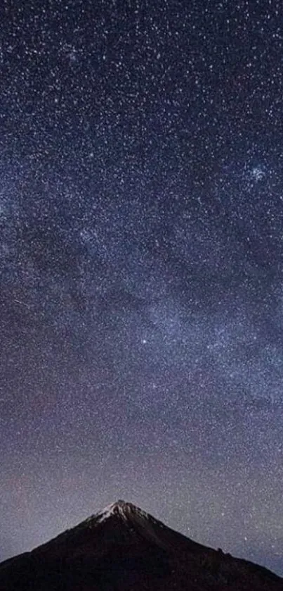 Starry night sky above a mountain peak, perfect for mobile wallpaper.