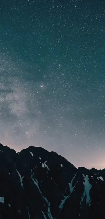 Starry night sky over dark mountain silhouettes.