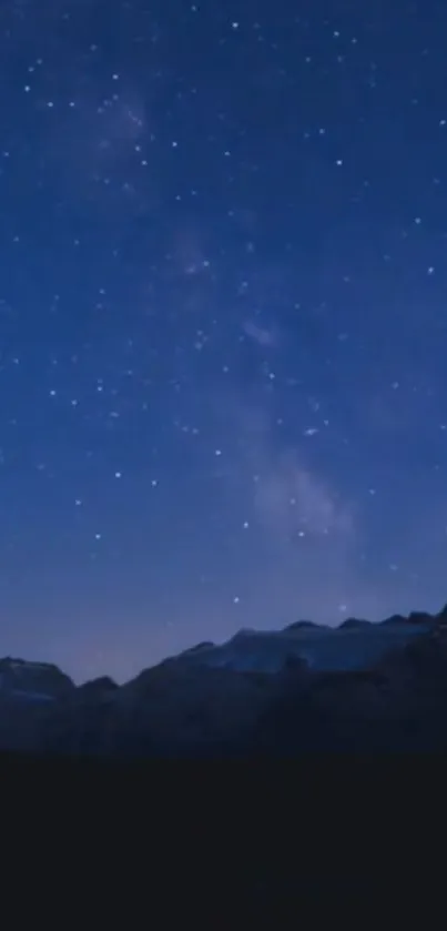 Starry night sky over mountains scenery wallpaper.