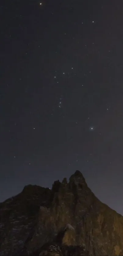 Starry night over mountains wallpaper with serene sky.