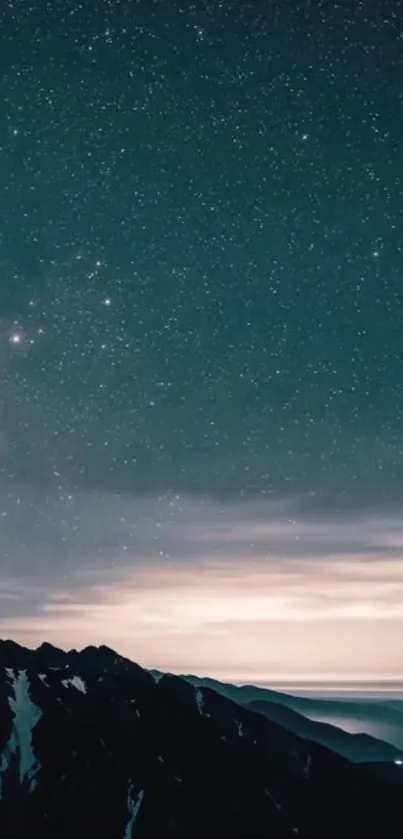 Majestic starry night sky over silhouetted mountains.