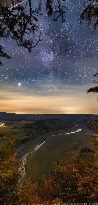 Starry night sky over a peaceful river landscape.