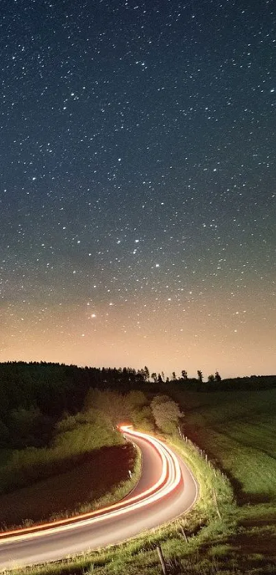 Starry night sky with a winding road beneath.